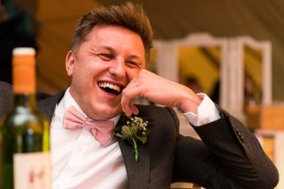 laughing wedding guest