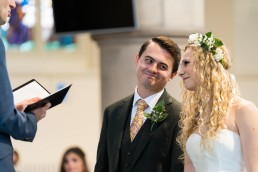 groom smiling at bride