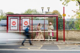 slow shutter speed portrait of a sikh bride and groom at a bus stop in Leeds