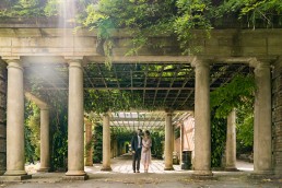 man and woman hug underneath a large canopy in Harrogate