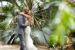 bride and groom have a passionate kiss in the botanical gardens, Sheffield