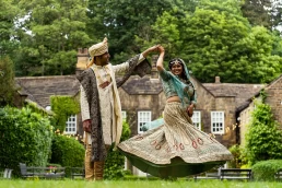 indian bride and greoom dance on the lawn of whitley hall, a top sheffield wedding venue
