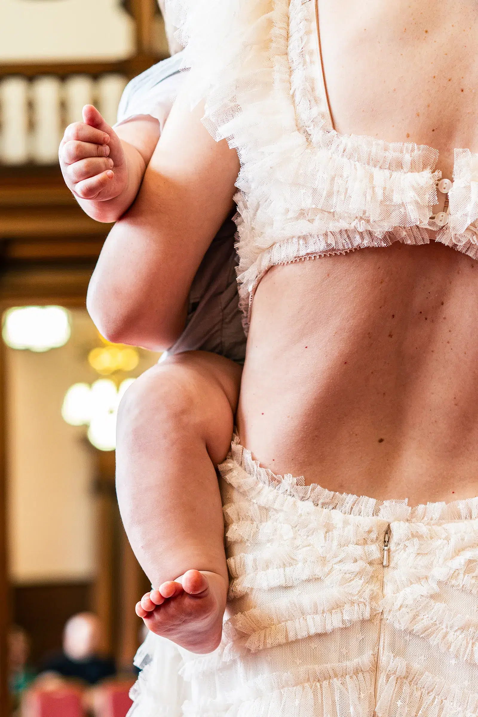 Bride holding baby during wedding day at Sheffield Town Hall